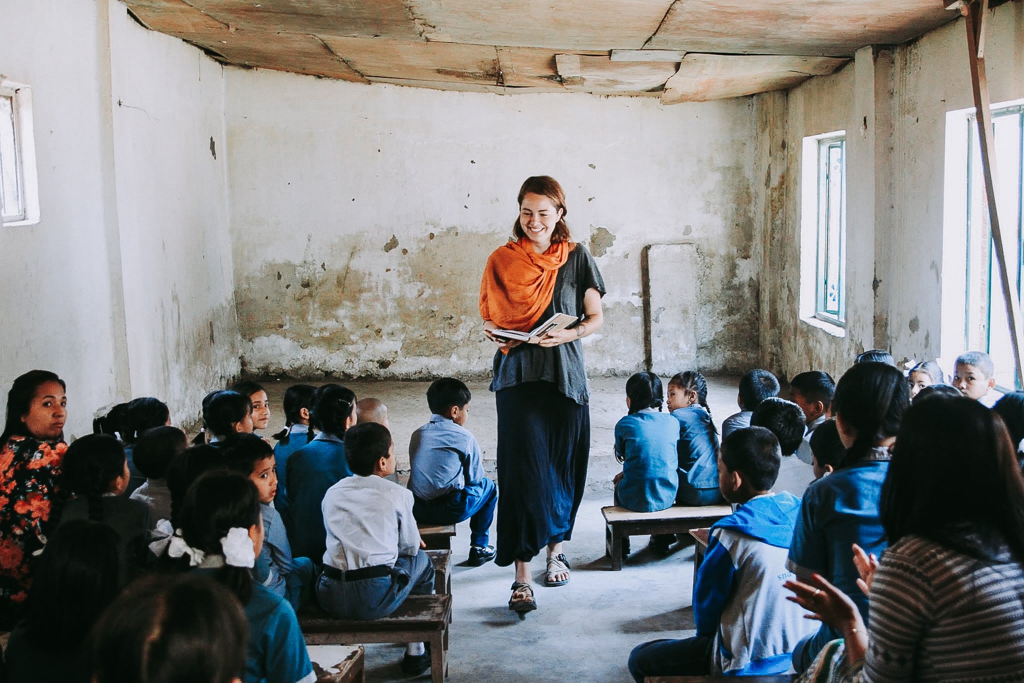 YWAMER teaching English to a group of kids