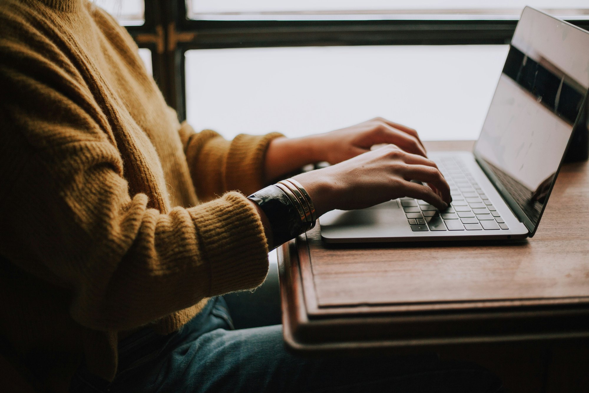 ywamer typing on her computer - by christin-hume