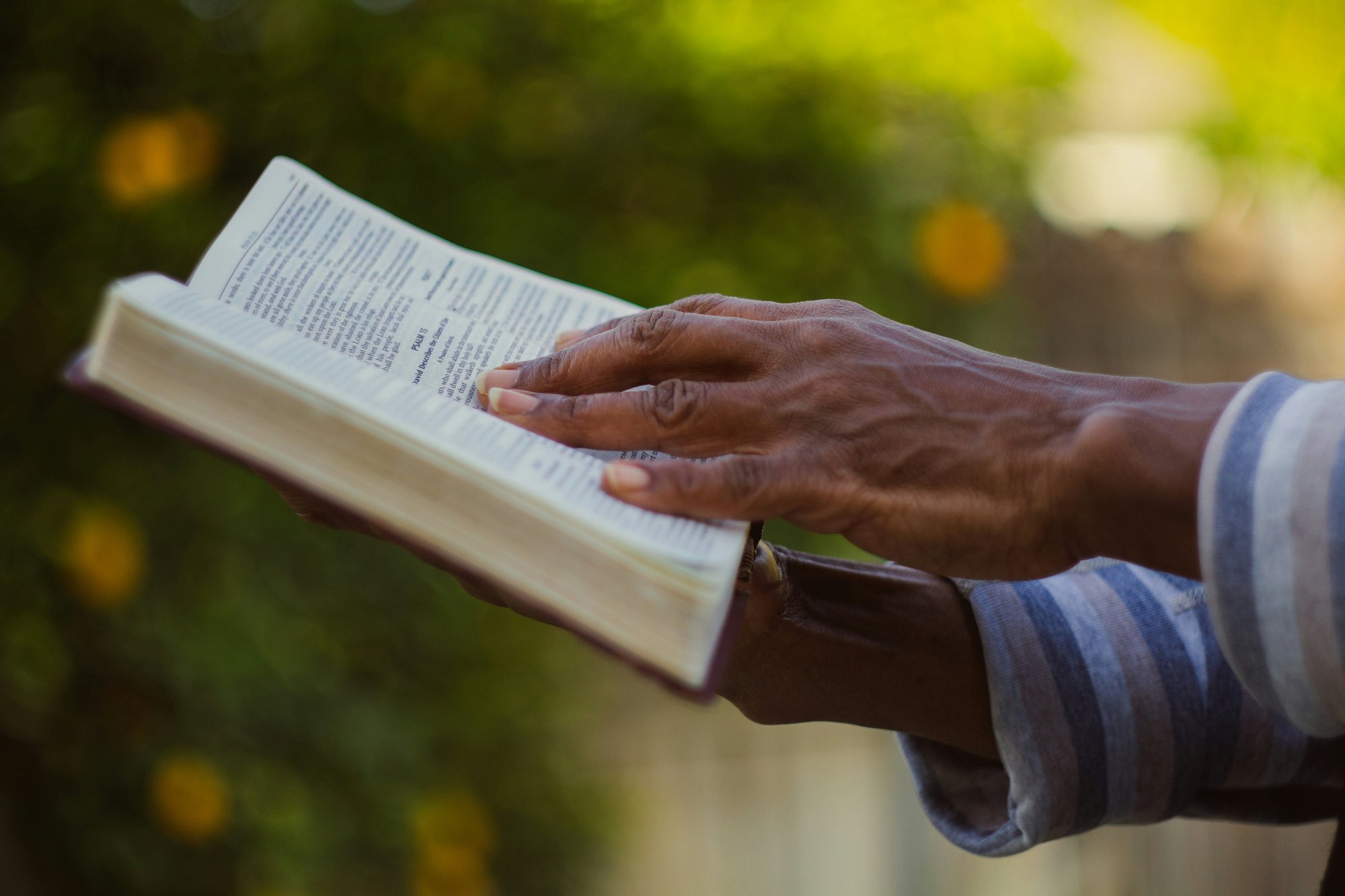 ywamer holding the bible by emmanuel-phaeton